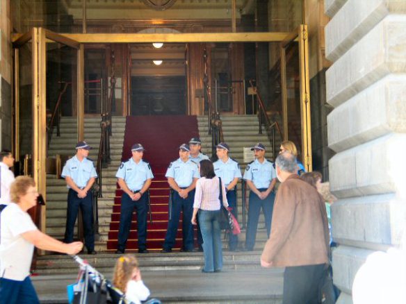 Line of police on steps block admission