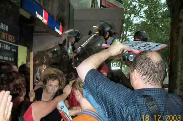 Mounted police ride into protesters