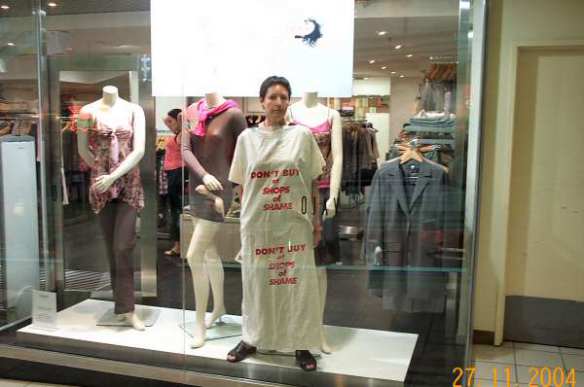 At Ojay - campaigner in window dressed in sack with anti-sweatshop message