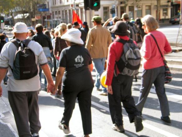 Marchers, one wearing RAC-Vic t-shirt