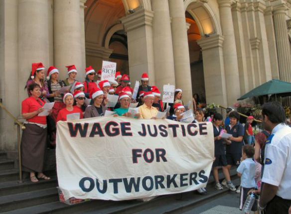 Banner and choir - Wage Justice for Outworkers