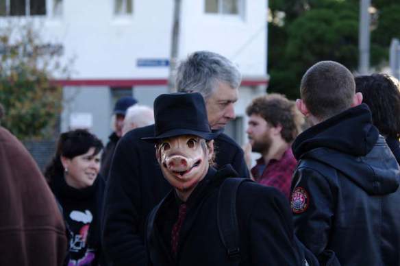 Protester wearing pig mask