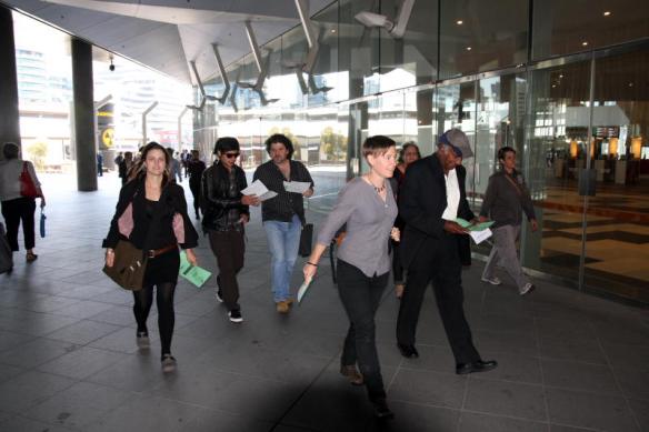 Group of elders and supporters heading for main entrance