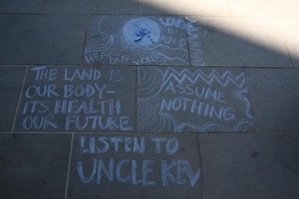 Chalked message on pavement - ends Listen to Uncle Kev