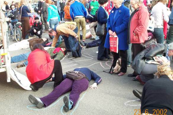 Outlining bodies on the ground in memory of   the drowned last October