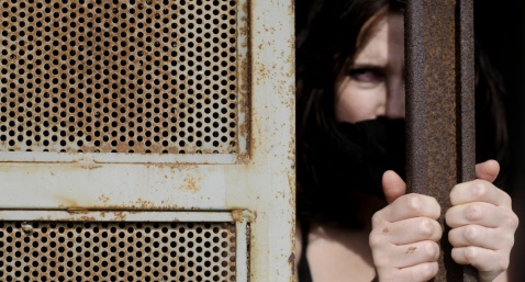 Image: Female prisoner with mouth gagged (Shutterstock.com)