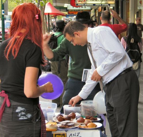 Another 'customer' chooses a cake