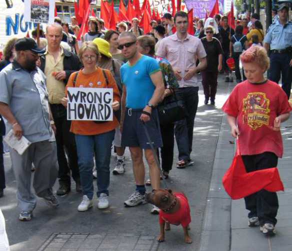 Protesters and dog with placard: Wrong Howard