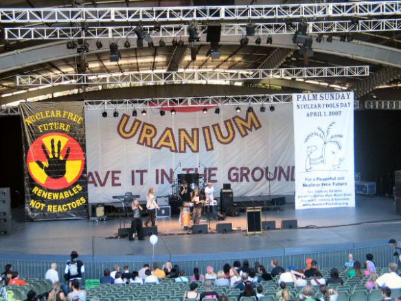 Anti-nuclear banners form backdrop on stage