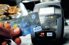 A customer pays by Visa payWave. Contactless payment systems have become popular in an increasingly cashless society. 