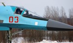 Russian President Dmitry Medvedev, seen in cockpit at left, wearing a flying helmet and an oxygen mask aboard an Su-34 war plane shortly after a flight at the Kubinka airfield near Moscow, in Kubinka, Russia, Saturday, March 28, 2009.