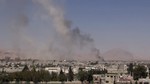 File - This image made from video posted online by the Shaam News Network, a loosely organized group opposed to Bashar Assad, on Sunday, Aug. 16, 2015, which has been verified and is consistent with other AP reporting, shows smoke riding from Syrian government airstrikes in Douma, a suburb of Damascus, Syria.