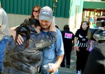 Friends and family are reunited with students at the local fairgrounds after a deadly shooting at Umpqua Community College, in Roseburg, Ore., Thursday, Oct. 1, 2015.