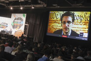 File - Edward Snowden talks during a simulcast conversation during the SXSW Interactive Festival on Monday, March 10, 2014, in Austin, Texas.