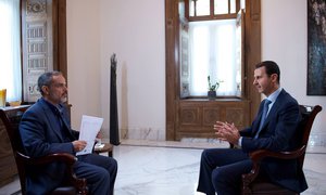 This photo released by the Syrian official news agency SANA, shows Syrian President Bashar Assad speaking during an interview with Iran's Khabar TV, in Damascus, Syria, Sunday, Oct. 4, 2015.