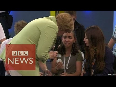 Angela Merkel criticised over crying refugee - BBC News