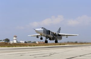 In this photo taken on Saturday, Oct. 3, 2015, Russian SU-24M jet fighter armed with laser guided bombs takes off from a runaway at Hmeimim airbase in Syria. The skies over Syria are increasingly crowded, and increasingly dangerous. The air forces of multiple countries are on the attack, often at cross purposes in Syria’s civil war, sometimes without coordination and now, it seems, at risk of unintended conflict. The latest entry in the air war is Russia. It says it is bombing the Islamic State in line with U.S. priorities, but the U.S. says Russia is mainly striking anti-government rebels in support of its ally, President Bashar Assad. The Russians, who are not coordinating with the Americans, reportedly also have hit U.S.-supported rebel groups.