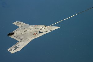 The Navy's unmanned X-47B receives fuel from an Omega K-707 tanker while operating in the Atlantic Test Ranges over the Chesapeake Bay, Patuxent River, Maryland, 22 April, 2015.