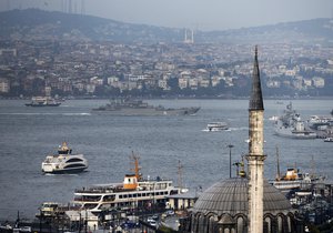 A Russian warship passes through the Bosphorus, in Istanbul, en route to the Mediterranean Sea, Tuesday, Oct. 6, 2015.