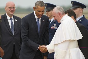 File - President Barack Obama greets Pope Francis at Joint Base Andrews, Md., Sept. 22, 2015. This marks the first visit by the current pope to the United States.