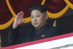 North Korean leader Kim Jong Un gestures as he watches a military parade in Pyongyang, North Korea, Saturday, Oct. 10, 2015.