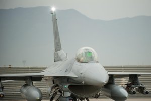 File - An F-16 Fighting Falcon pilot assigned to the 555th Expeditionary Fighter Squadron goes through a preflight inspection before a combat sortie at Bagram Airfield, Afghanistan, Sept. 22, 2015.