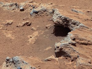 File - Remnants of Ancient Streambed on Mars (White-Balanced View): NASA's Curiosity rover found evidence for an ancient, flowing stream on Mars at a few sites, including the rock outcrop pictured here, which the science team has named "Hottah" after Hottah Lake in Canada's Northwest Territories.