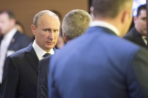 File - Vladimir Putin (centre left), President of the Russian Federation, following his addresses to the general debate of the General Assembly’s seventieth session, 28 September, 2015.