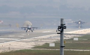 File - Turkish Air Force fighter planes land at Incirlik Air Base, on the outskirts of the city of Adana, southern Turkey, Thursday, July 30, 2015.