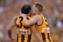 Hawthorn's no 5 Sam Mitchell kisses Hawthorn's no 33 Cyril Rioli.  Hawthorn win the 2015 AFL Grand Final at the MCG. 