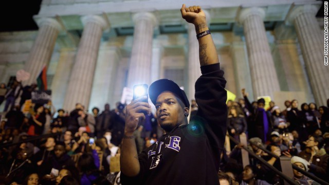 Protesters gather on the steps of the National Portrait Gallery in Washington on Tuesday, November 25. A grand jury's decision not to indict Darren Wilson, a white police officer, in the August shooting death of unarmed black teenager Michael Brown in Ferguson, Missouri, has prompted demonstrations across the country. 