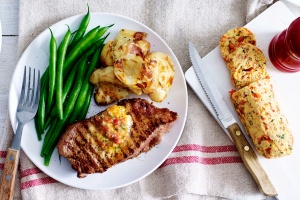 Steak with roasted tomato and basil butter