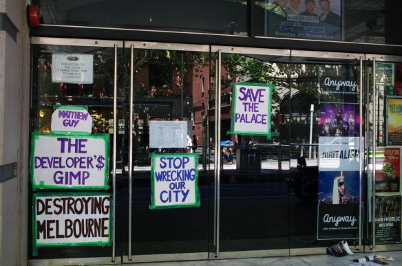 Placards fixed to entrance of theatre