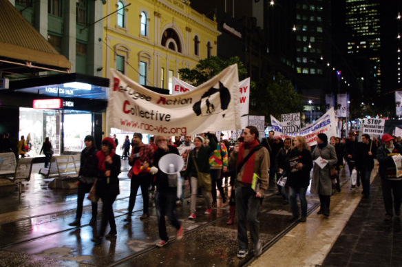 Refugee Action Collective banner leading march along Bourke Street