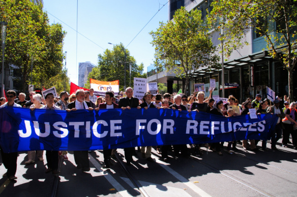 Justice for Refugees banner at head of march