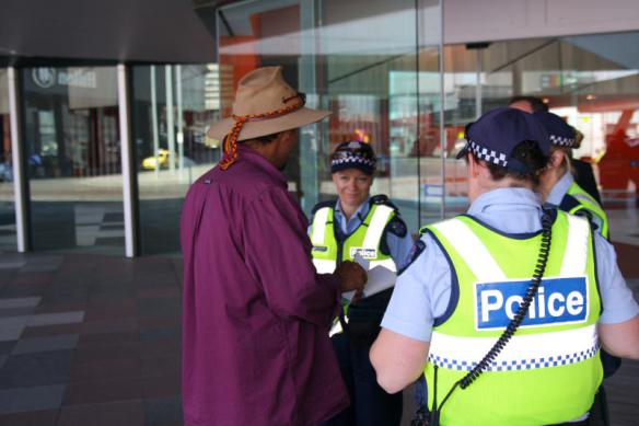 Peter Watts checked by police at entrance