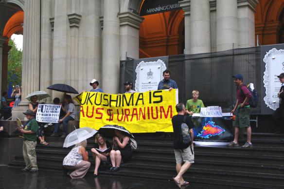 Protesters under umbrellas