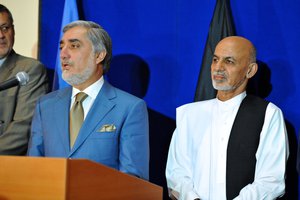 File - Afghan presidential candidate Abdullah Abdullah delivers remarks at a press conference with Afghan presidential candidate Ashraf Ghani and U.S. Secretary of State John Kerry (unseen) in Kabul, Afghanistan on August 8, 2014.