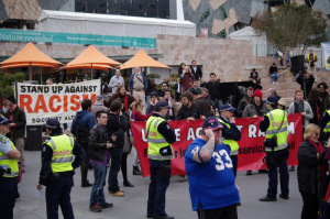 The same, police line, and counter-demonstrators assembling behind