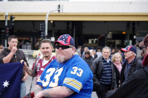 ADL supporter in 'Aussie' cap and blue t-shirt