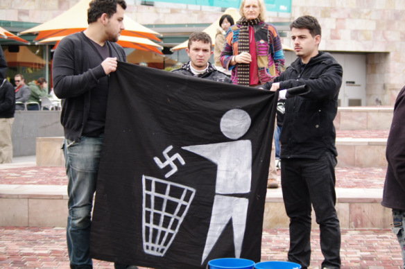 Anti-fascist banner - consigning swastika to dustbin