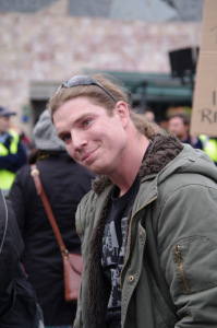 ADL supporter pulls face, possibly for photo