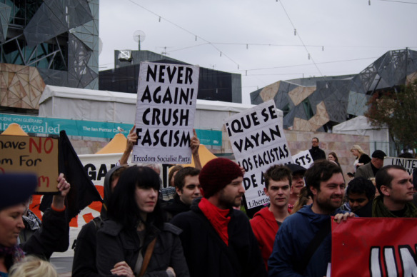 Anti-fascist placards including Freedom Socialist Party