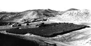 File - Barrels of contaminated soil collected at Palomares, Spain, for removal to the United States, following a nuclear accident, 1966. As a result of the accident, an estimated 1,400 tons of radioactive soil and vegetation was excavated, packed in 55-gallon drums, and sent to the United States for disposal at the Savannah River Plant in South Carolina