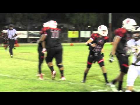 Long Beach Millikan football player kicks Lakewood player