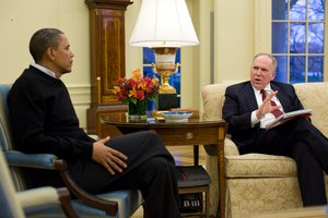 File - President Barack Obama meets with John Brennan, Deputy National Security Advisor for Counterterrorism and Homeland Security, in the Oval Office, Jan. 4, 2010.