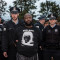 In this October 24, 2015 photograph, white police arrest a black activist that participated in a direct action against an international police conference in Chicago. The activist is wearing a shirt with an image of Rekia Boyd, who was fatally shot by an off-duty Chicago police officer. (Flickr / sarah-ji)