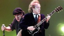 Angus Young (right) is the only original member of AC/DC remaining.