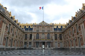 Cour de marbre, Palace of Versailles with the French flag raised ready for Bastille Day 2011