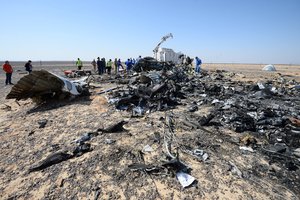 In this Russian Emergency Situations Ministry photo, made available on Monday, Nov. 2, 2015 Russian and Egyptian experts work at the crash site of a Russian passenger plane bound for St. Petersburg in Russia that crashed in Hassana, Egypt's Sinai Peninsula, on Monday, Nov. 2, 2015.